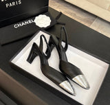 black leather slingback shoes with metallic silver cap toes featuring the signature Chanel CC logo