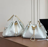 suede Chanel 25 handbags feature diamond quilting and iconic goldand silver tone CC chain drawstrings