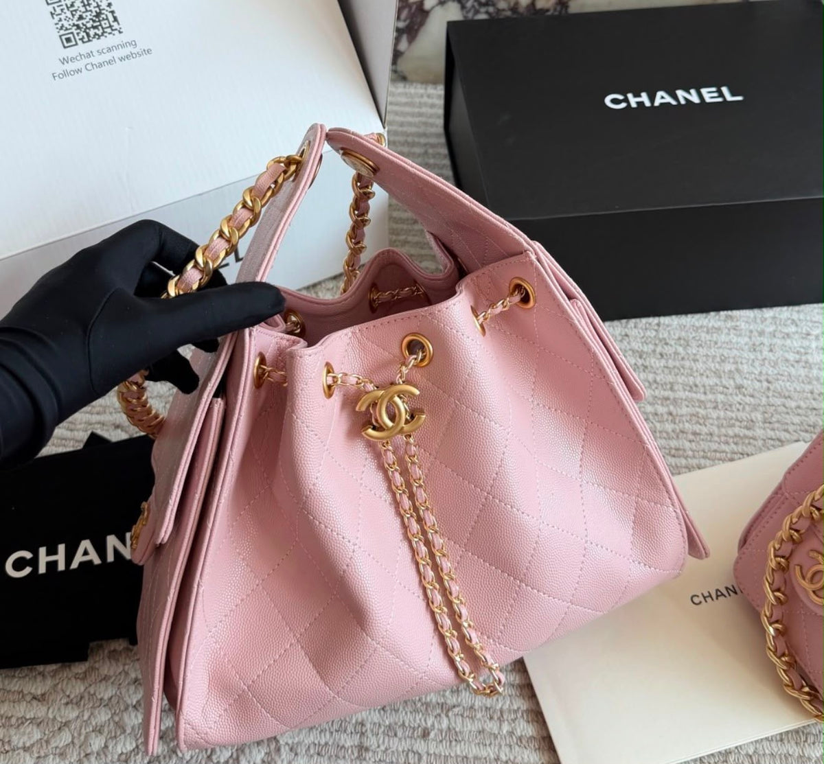 suede Chanel 25 handbags feature diamond quilting and iconic goldand silver tone CC chain drawstrings