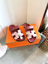Hermès Chypre sandals featuring the iconic cutout "H" vamp and an adjustable upper strap
