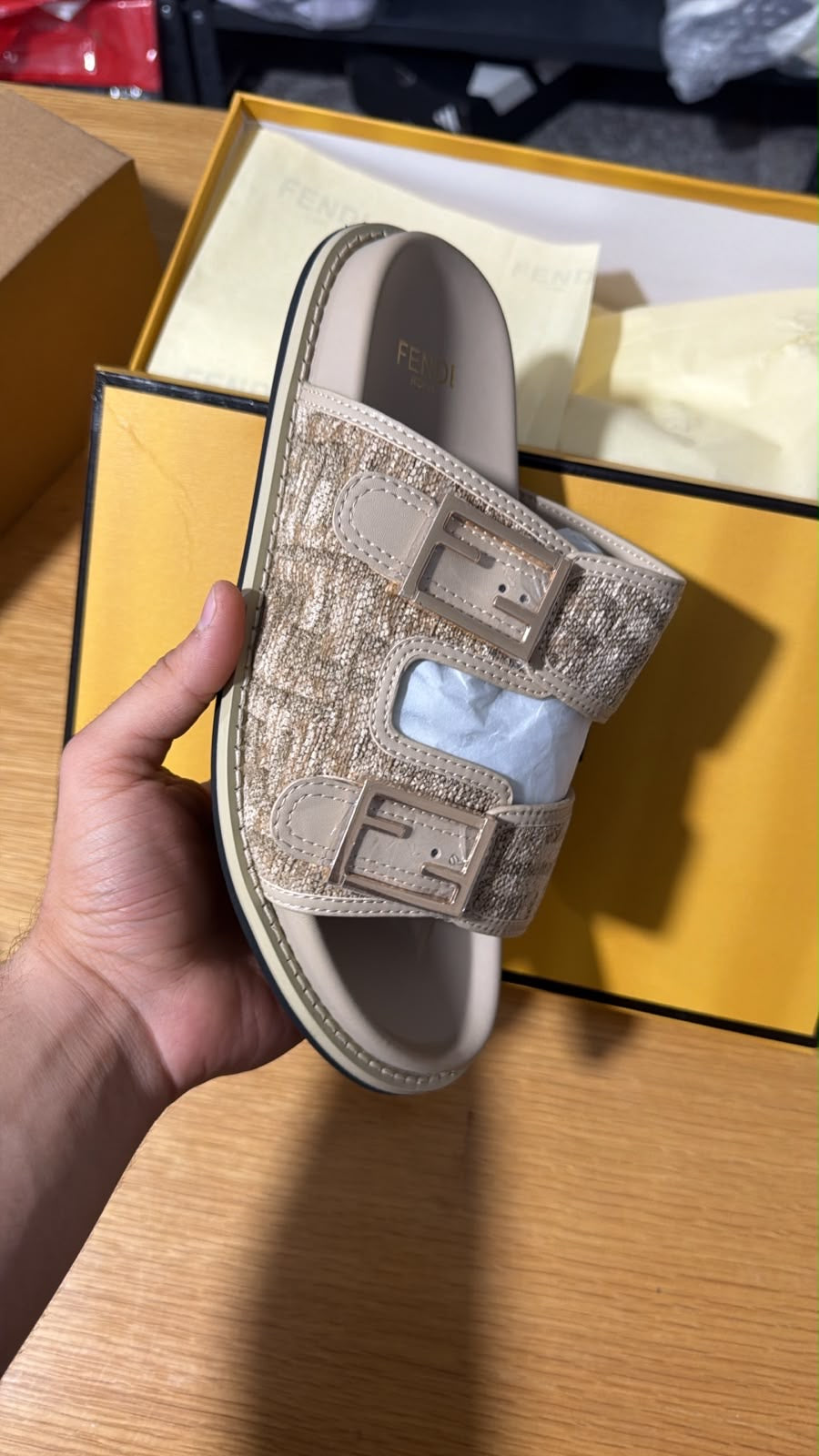 Fendi Feel FF jacquard slide sandals featuring two buckled straps with the iconic monogram pattern.