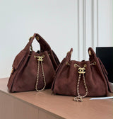 suede Chanel 25 handbags feature diamond quilting and iconic goldand silver tone CC chain drawstrings