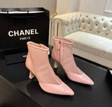 These are pink mesh and leather pointed-toe ankle booties featuring a delicate embroidered CC logo on the toe