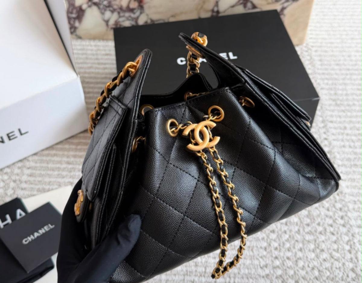 suede Chanel 25 handbags feature diamond quilting and iconic goldand silver tone CC chain drawstrings