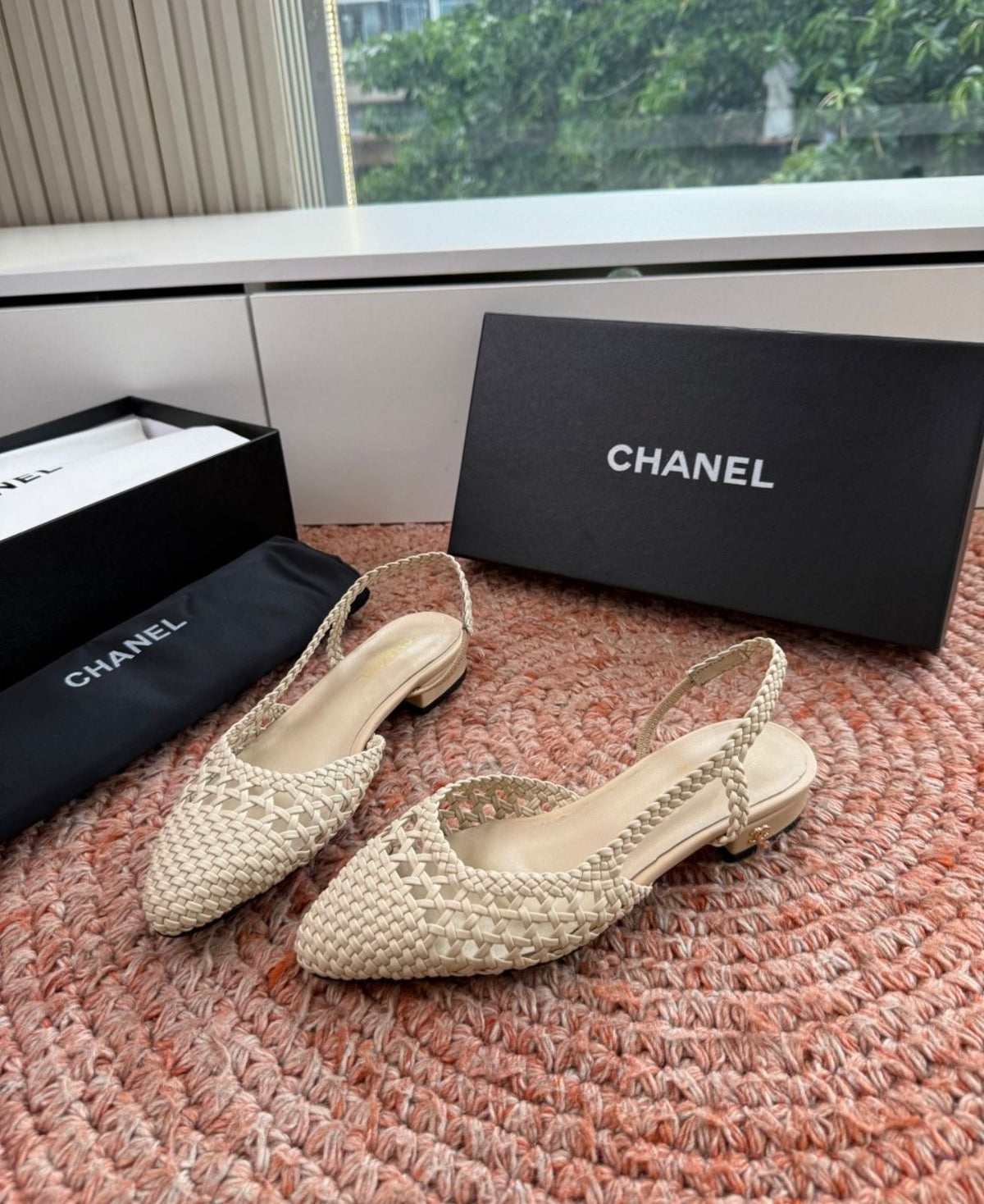 Channel woven slingback flats featuring an intricate braided design and a sleek pointed toe