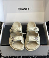 Chanel quilted lambskin dad sandals in a beige with double velcro straps and crystal-embellished CC logos