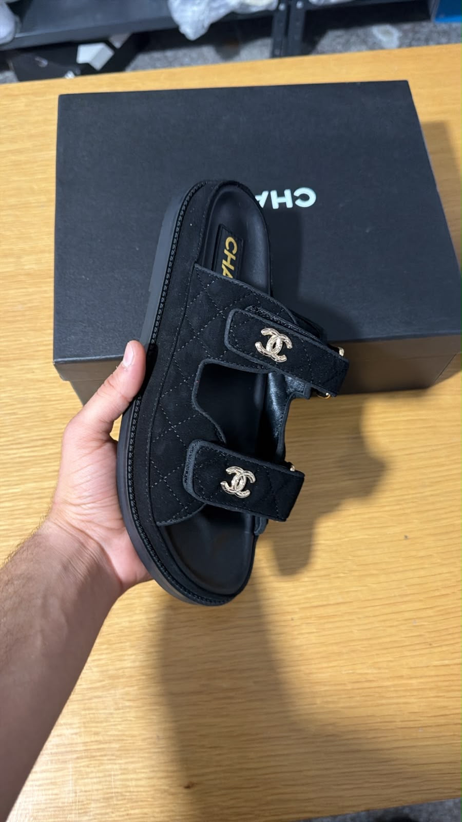 black quilted suede Chanel dad sandals featuring double straps accented with silver-toned CC logo hardware