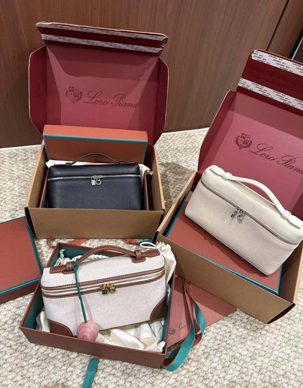 Loro Piana Extra Pocket L19 vanity-style handbag displayed in three different colorways
