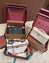 Loro Piana Extra Pocket L19 vanity-style handbag displayed in three different colorways