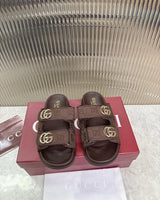Gucci double-strap sandals with gleaming light gold-toned Double G hardware