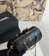 This stylish Chanel Croc-Embossed Bowling Cylinder Bag is beautifully crafted in black embossed leather with gleaming gold-tone hardware