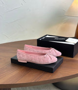 Ballerina flats, featuring a soft quilted texture and a delicate front bow with the signature CC logo