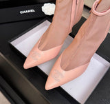These are pink mesh and leather pointed-toe ankle booties featuring a delicate embroidered CC logo on the toe