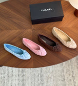 Ballerina flats, featuring a soft quilted texture and a delicate front bow with the signature CC logo