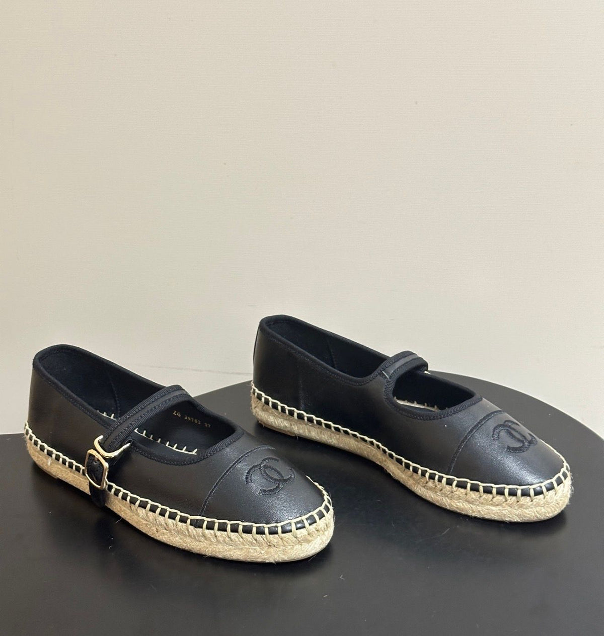 black lambskin Chanel Mary Jane Espadrilles, featuring a distinctive embroidered CC logo on the toe cap