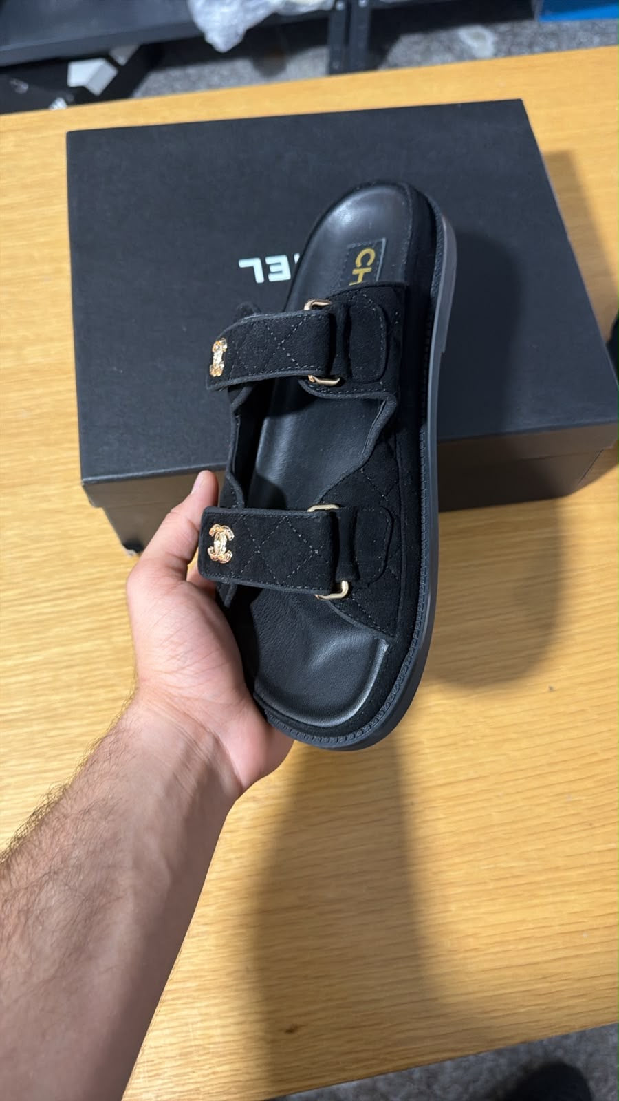 black quilted suede Chanel dad sandals featuring double straps accented with silver-toned CC logo hardware