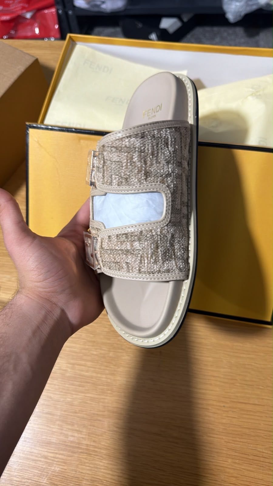 Fendi Feel FF jacquard slide sandals featuring two buckled straps with the iconic monogram pattern.