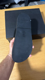 black quilted suede Chanel dad sandals featuring double straps accented with silver-toned CC logo hardware