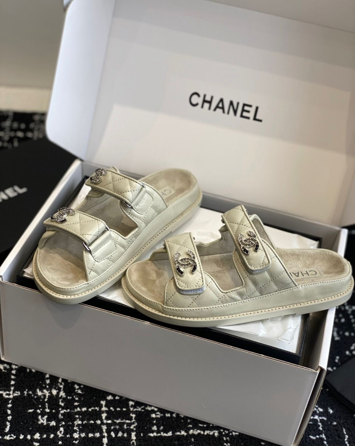 Chanel quilted lambskin dad sandals in a beige with double velcro straps and crystal-embellished CC logos