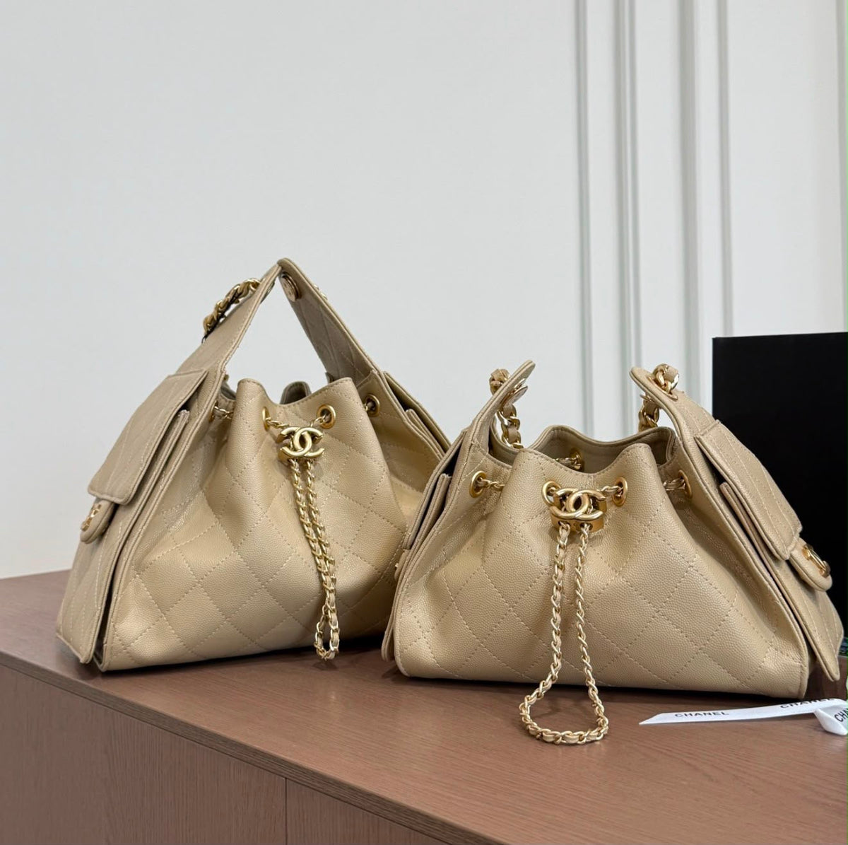 suede Chanel 25 handbags feature diamond quilting and iconic goldand silver tone CC chain drawstrings
