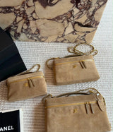 This is a Chanel Slim Long Vanity Case with Chain suede featuring gold tone hardware