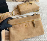 This is a Chanel Slim Long Vanity Case with Chain suede featuring gold tone hardware