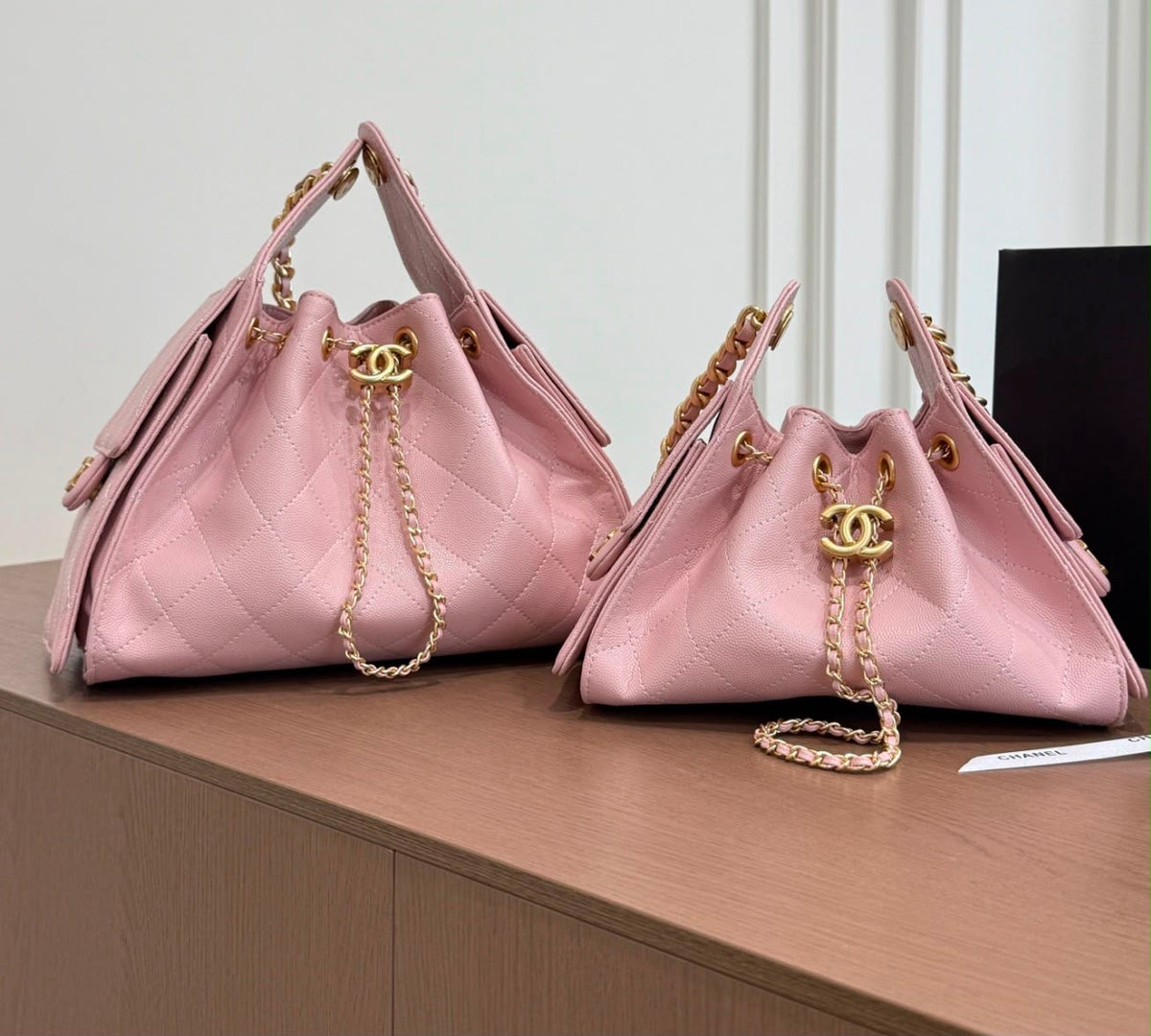 suede Chanel 25 handbags feature diamond quilting and iconic goldand silver tone CC chain drawstrings