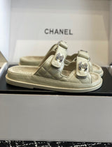 Chanel quilted lambskin dad sandals in a beige with double velcro straps and crystal-embellished CC logos