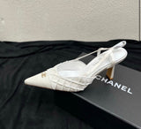 Channel slingback pumps featuring the signature embroidered CC logo on the cap toe
