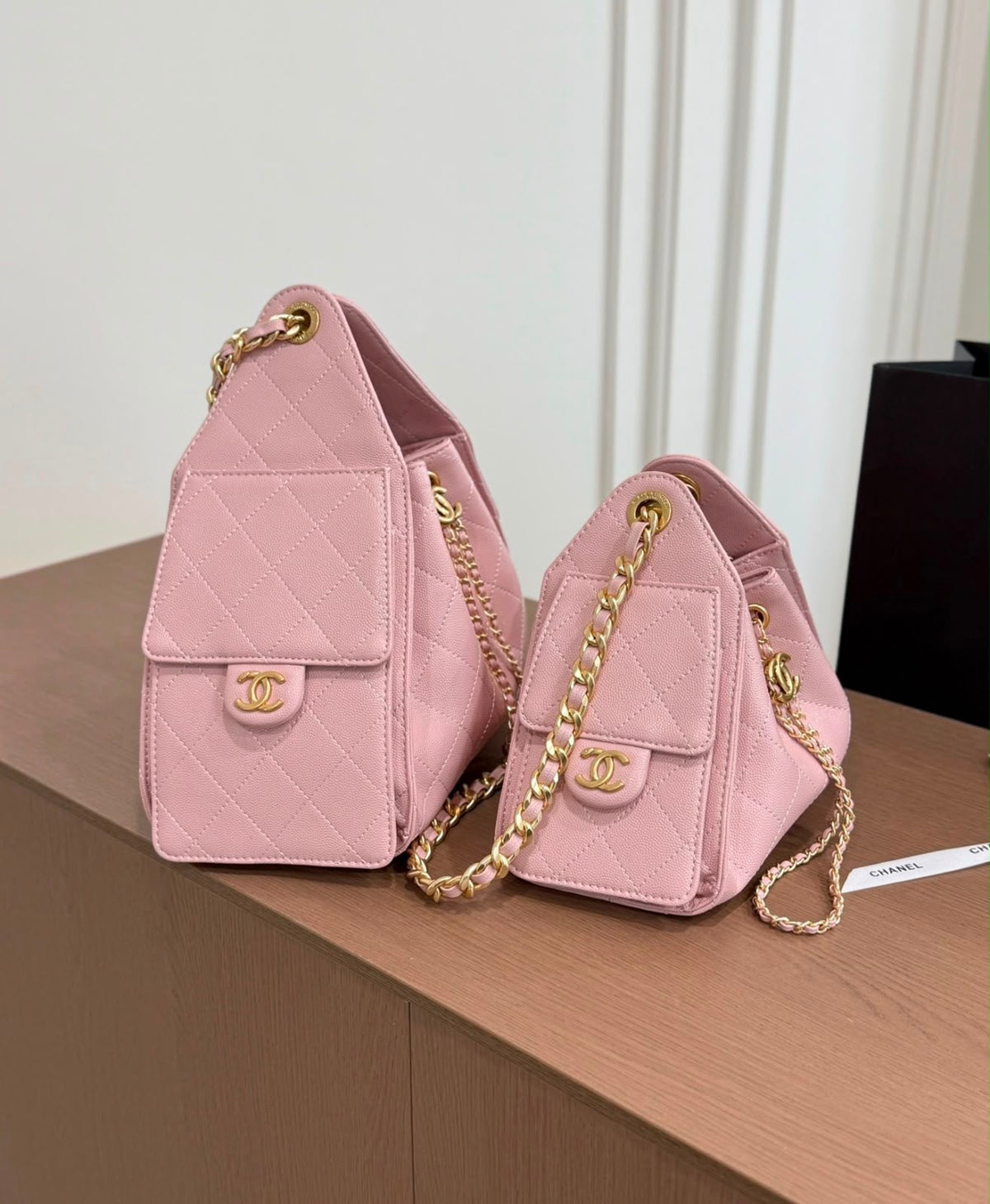 suede Chanel 25 handbags feature diamond quilting and iconic goldand silver tone CC chain drawstrings