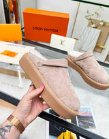 Louis Vuitton Aspen Platform Closed Mule features velvety debossed monogram suede calf leather and a plush shearling lining