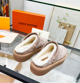Louis Vuitton Aspen Platform Closed Mule features velvety debossed monogram suede calf leather and a plush shearling lining
