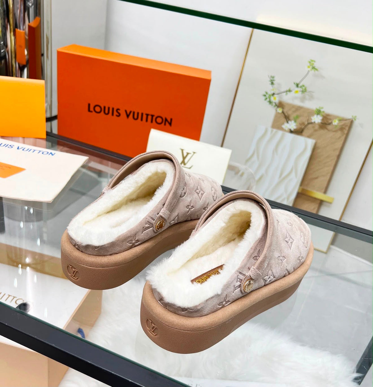 Louis Vuitton Aspen Platform Closed Mule features velvety debossed monogram suede calf leather and a plush shearling lining