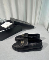 lambskin quilted CC turn-lock loafers by Chanel, featuring a quilted tongue detail with a gold-tone CC turn-lock closure