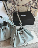 suede Chanel 25 handbags feature diamond quilting and iconic goldand silver tone CC chain drawstrings