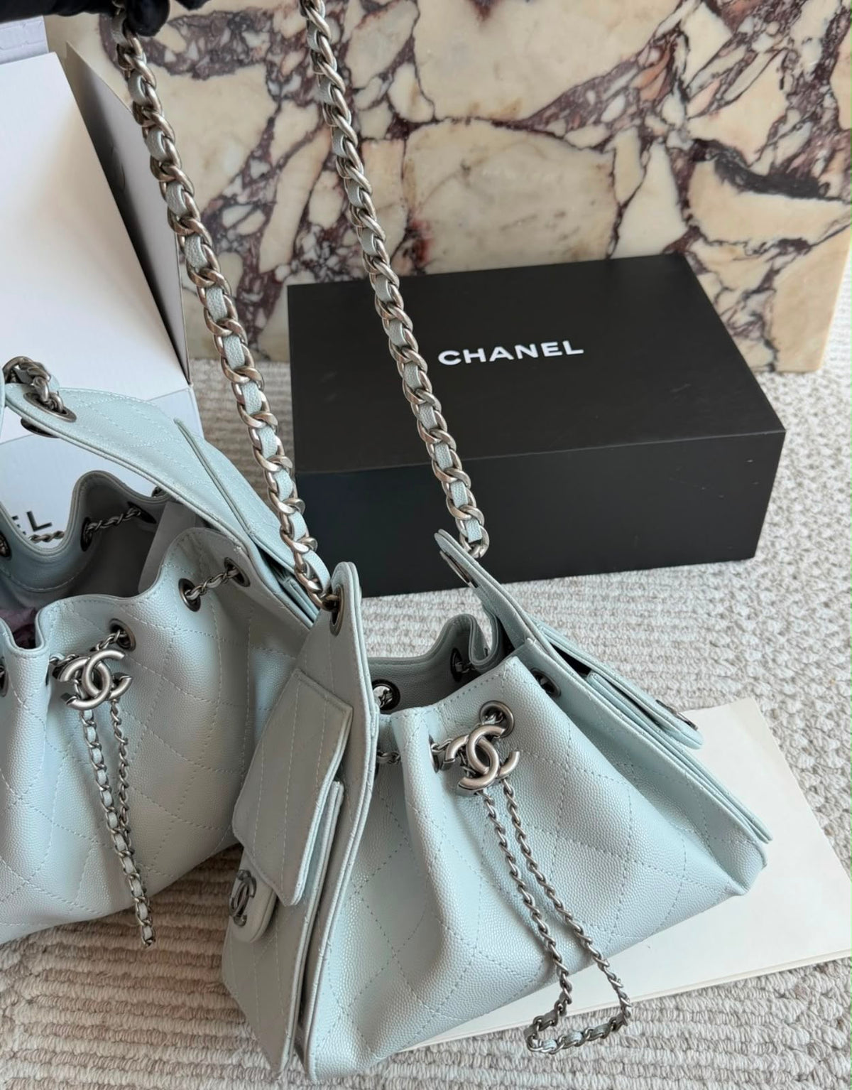 suede Chanel 25 handbags feature diamond quilting and iconic goldand silver tone CC chain drawstrings