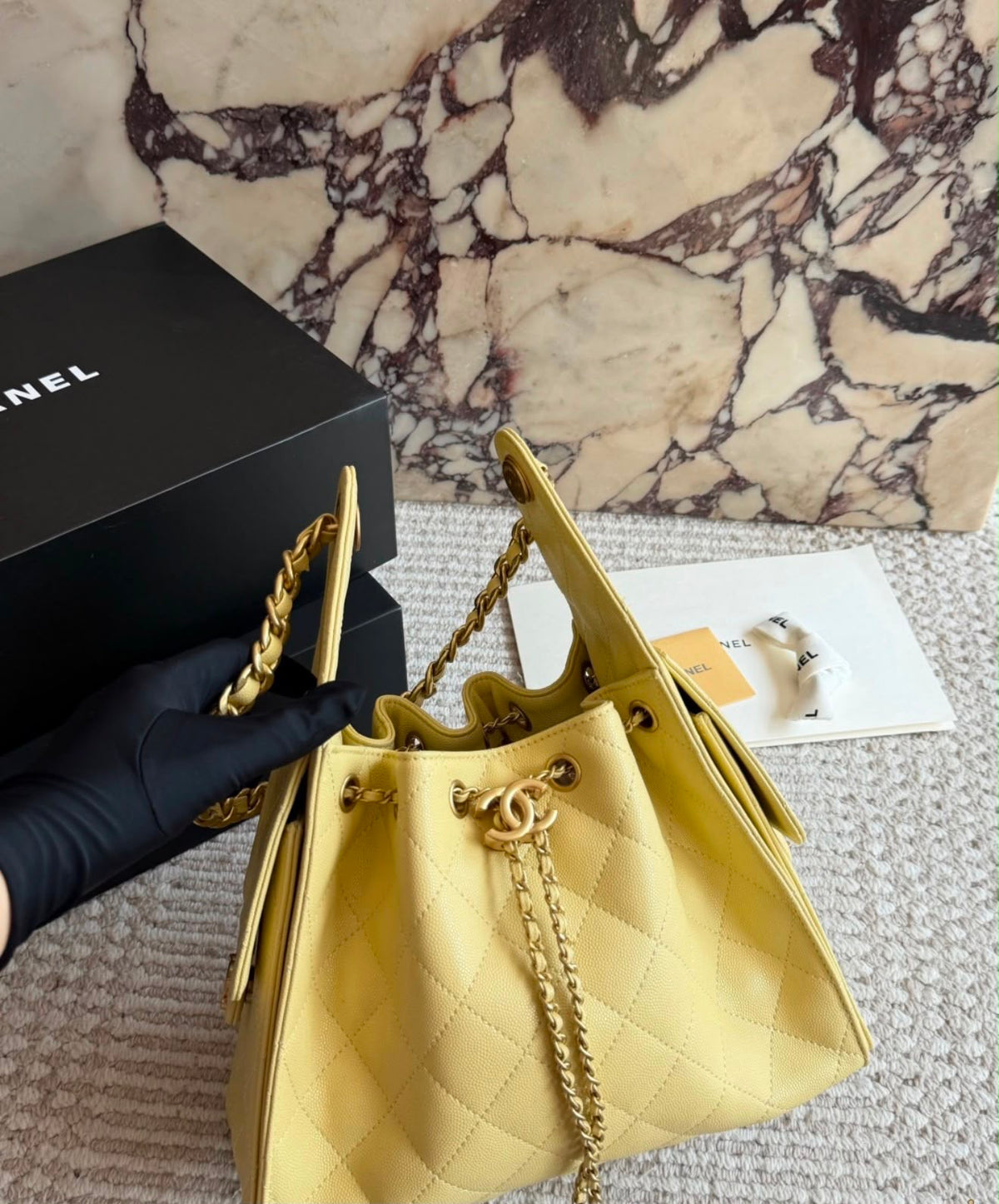 suede Chanel 25 handbags feature diamond quilting and iconic goldand silver tone CC chain drawstrings