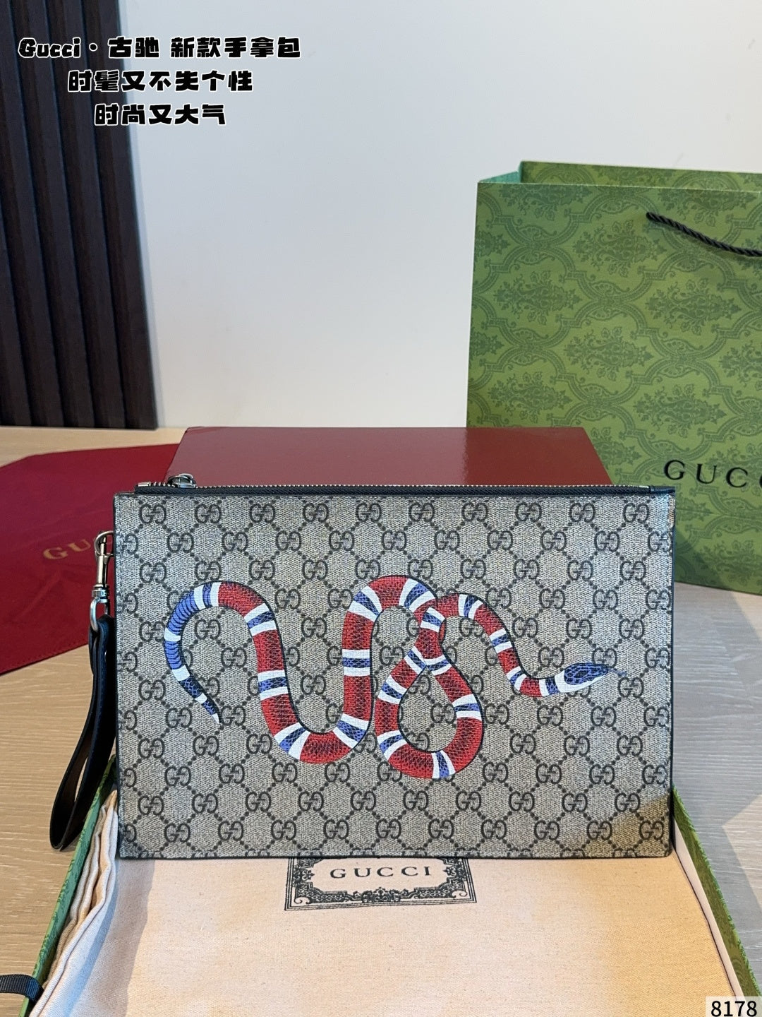 Gucci carrying a tiger head bag