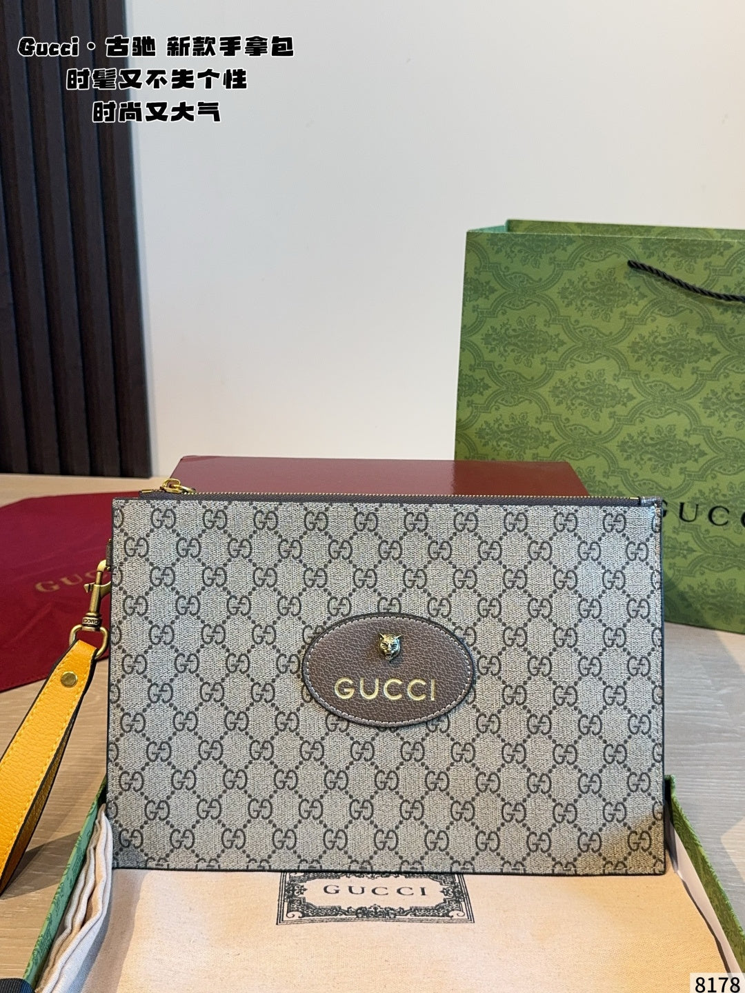 Gucci carrying a tiger head bag