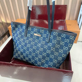 Comes with a box measuring 25*20 cm. This Gucci denim tote bag features GG Supreme monogram canvas with leather trim and handles, and a gold-tone metal logo plate. The bag has Gucci's classic structured tote silhouette, understated yet stylish, suitable for everyday wear without being too formal. (Ej)